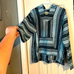 Trending poncho size large fits well around arm and stomach region
